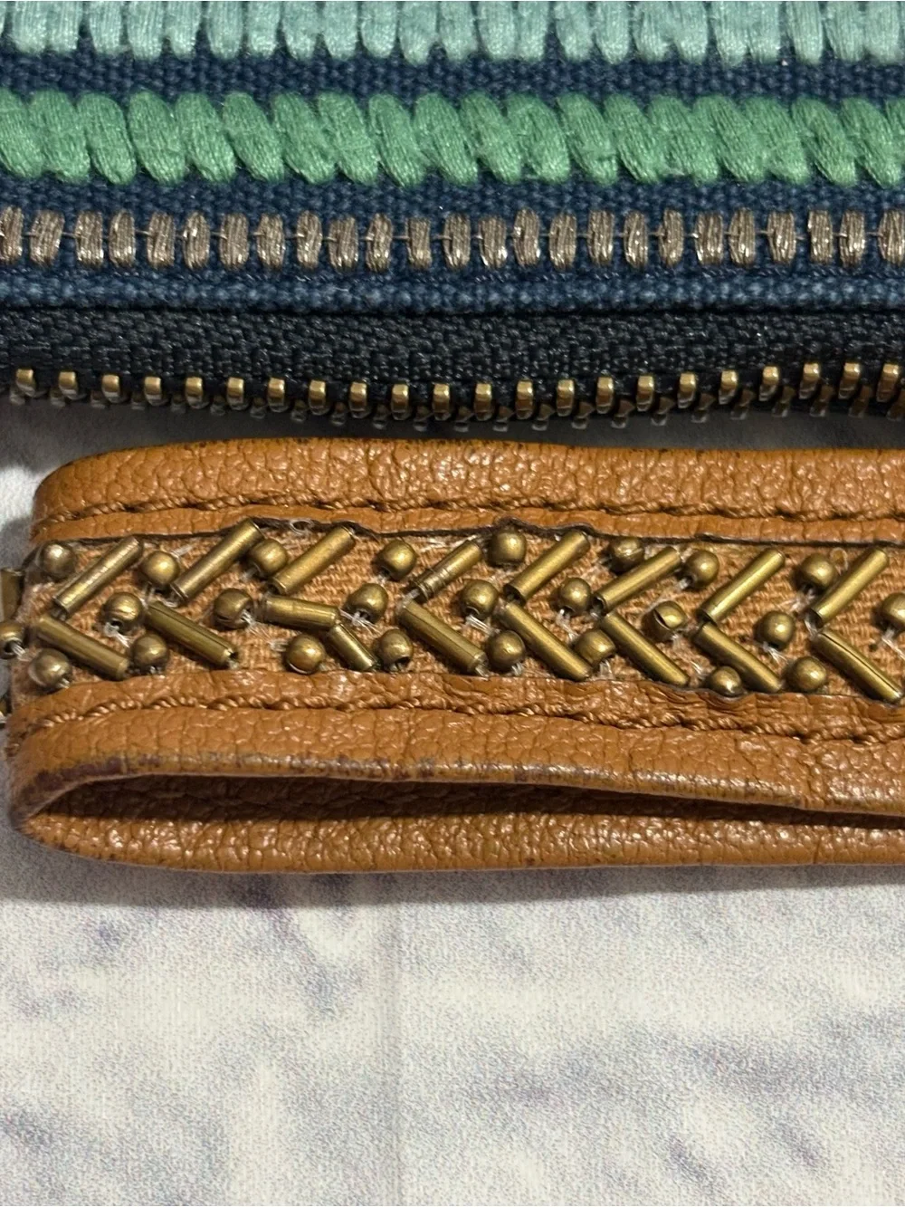 Jasper & Jeera navy/aqua striped stitch-work zipper pouch wristlet